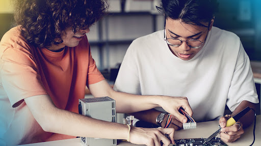 Photo of students working together.